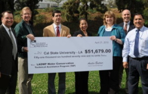 Los Angeles Department of Water and Power (LADWP) and Leah Murakami present a rebate check for $51,679 to California State University Los Angeles (CSULA) for proven water savings resulting from the installation of wireless water management technology that adjusts irrigation controllers in accordance with changing weather conditions— a water saving measure supported by LADWP’s Technical Assistance Program (TAP.)
